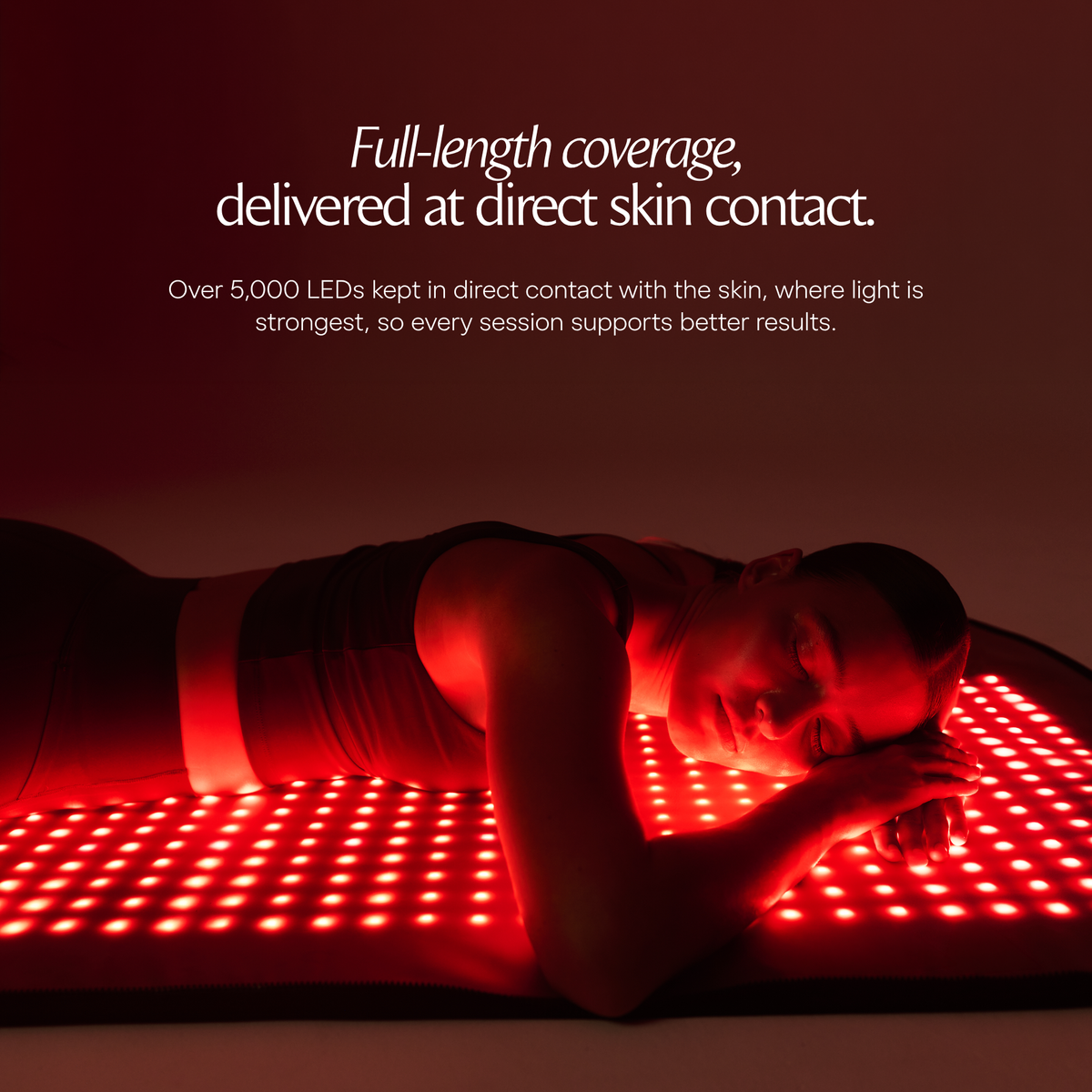 Woman lying on an illuminated Restora LED mat in a full-body lifestyle image