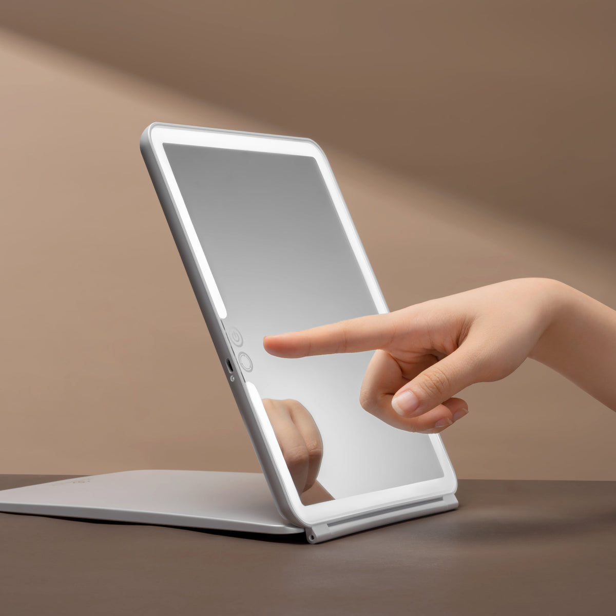 Mirrorvio+ LED travel mirror with touch-control adjustable brightness for perfect makeup application.