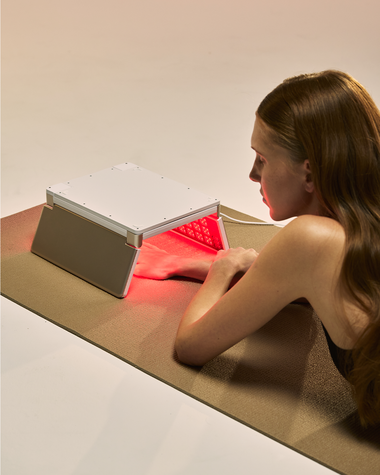 At-home LED hand rejuvenation treatment using a portable light therapy panel